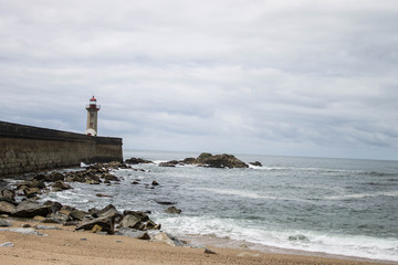 lighthouse on coast of sea