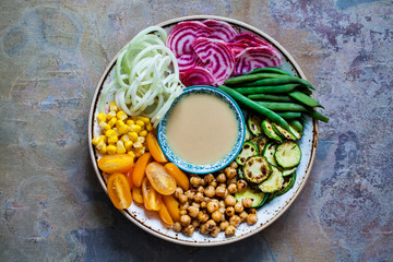Wall Mural - Buddha bowl with spicy chickpeas and crunchy vegetables