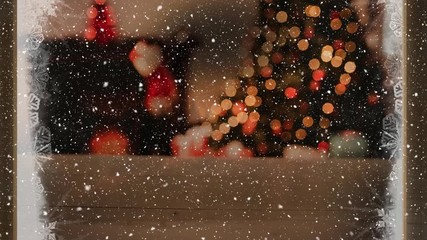 Wall Mural - Video composition with snow over room  with Christmas decorations viewed through icy window