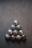 Fototapeta Desenie - Christmas tree made by silver Christmas balls on the dark background with copy space