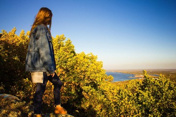 Young girl on the rock.