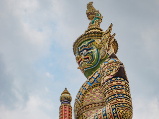 Giant The front of gate with Cloud sky in Wat phrakaew Temple Bangkok city thialand