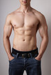 © Axel Bueckert - toned male torso with muscular arms and sixpack fitness or bodybuilding concept