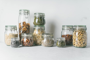 Canvas Print - Glass jars with Superfoods nuts and cereals stacked on top of each other