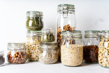 Sticker - Glass jars with Superfoods nuts and cereals stacked on top of each other