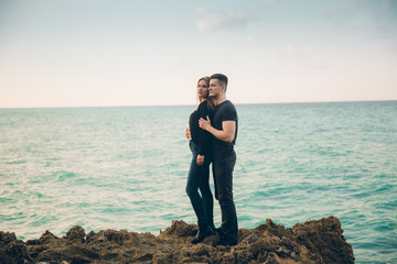 Wall Mural - young couple in love near the sea