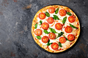 Canvas Print - Pizza Margherita with mozzarella cheese, basil and tomatoes Traditional italian food. Classic recipe. Top view