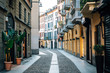 A colorful cobblestone street in Brera, Milan, Italy.