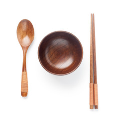 Wall Mural - Wooden spoon and chopsticks with bowl isolated on white background. Top view.