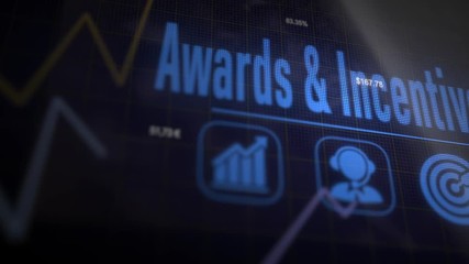Awards and Incentives business concept on a flashing computer monitor with moving graphs and data.