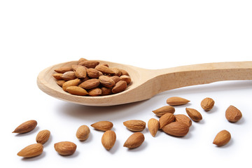 Wall Mural - Pelled almonds in woodeen spoon. Cut out.