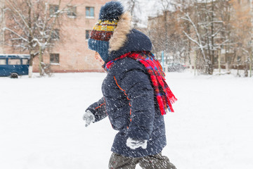 Poster - cheerful boy walks in the snow in the winter