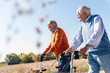 © Westend61 - Two old friends walking on a country road, using wheeled walkers