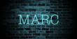 first name Marc in blue neon on brick wall