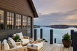 © Jean Allsopp - Wooden house with terrace over lake