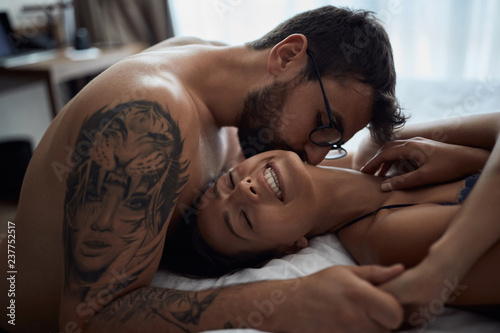 Cuadros en Lienzo Tenderness in every touch. couple in bedroom..