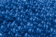Water Blue Gel Balls With Bokeh. Polymer Gel. Silica Gel. Balls Of Blue Hydrogel. Crystal Liquid Ball With Reflection. Blue Texture Background. Macro