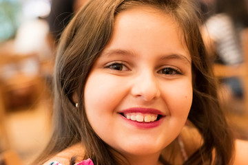 close-up on face of child girl smiling