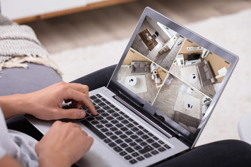 Aufkleber - Man Monitoring Video Footage On Laptop