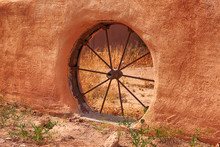 Old Wagon Spoke Wheel Set In An Adobe Wall In Las Cruces NM