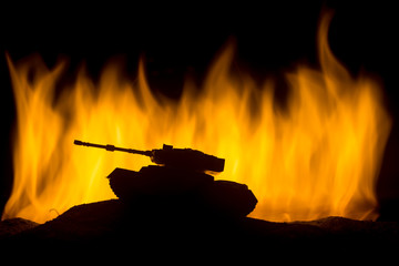 War Concept. Military silhouettes fighting scene on war fog sky background, World War German Tanks Silhouettes Below Cloudy Skyline At night. Attack scene. Armored vehicles. Tanks battle