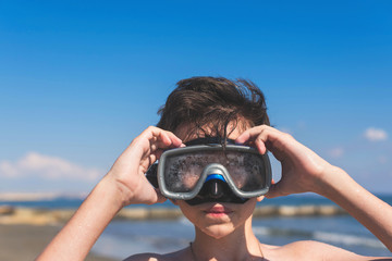 Wall Mural - Closeup of boy face in the snorkeling mask. Travel and summer concept