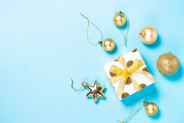 Christmas flatlay background - silver and gold decorations on bl