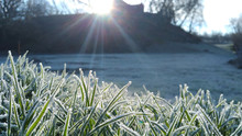 Rural Morning, The Rays Of The Sun And The Grass Covered With Frost