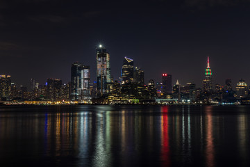 Wall Mural - Manhattan skyline panorama with Times Square lights at dusk, New York City