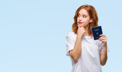 Wall Mural - Young beautiful woman holding passport of germany over isolated background serious face thinking about question, very confused idea