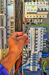 Wall Mural - Control panel with terminals and wires inside view