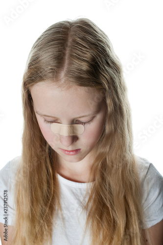 Young Girl With Curly And Blonde Hair Has Green Patch From Injury