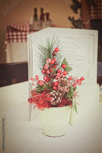 Restaurant Table With Traditional Christmas Decorations In Rome