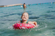 красивая маленькая девочка купается в море плещется и смеется beautiful little girl swimming in the sea splashing and laughing