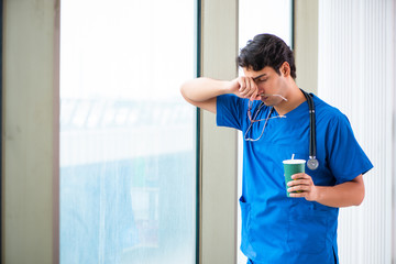 Sticker - Young handsome doctor working in the hospital 