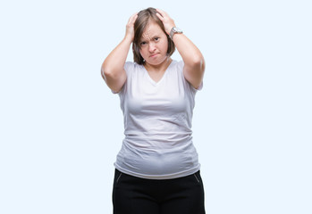 Sticker - Young adult woman with down syndrome over isolated background suffering from headache desperate and stressed because pain and migraine. Hands on head.