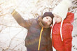 © alexkich - Children in winter park play