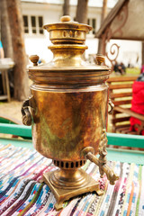 Russian traditional copper samovar for making tea.  Historic water boiling appliance close-up