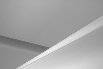 Poster - Refined abstract architecture or interior design photo of plastered ceiling. Minimalist geometric background with angular structure and copyspace for text placement.