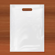 Quality Plastic Bag on wooden background,white plastic bag.Realistic Shopping Bag for branding and corporate identity design.Vector set mock up.