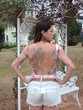 mulher com costas tatuada fenix tatuagens de mulher estilosa
