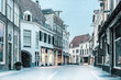 Shopping street with snowfall in the Dutch city center of Zutphen