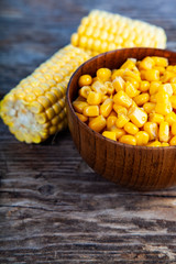 Wall Mural - Ripe corn on an old wooden table.