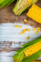 Wall Mural - Ripe corn on a wooden table