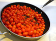 Kitchen pan with sauteed red grape tomatoes