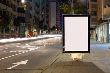 Wall Mural - Blank advertisement billboard, with blurred traffic lights at night