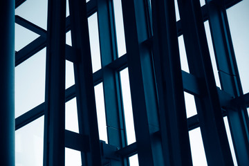 Poster - Steel and glass structure with metal framework of an office building exterior fragment. Abstract modern architecture background.