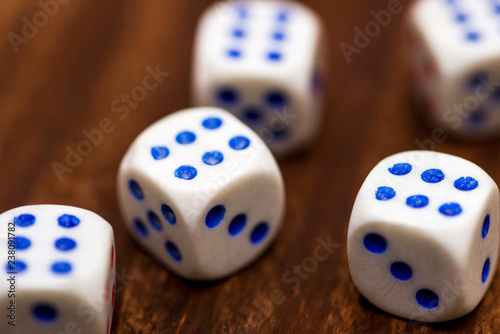 фотография Five dice on a wooden desk. Five dice shows the six, what a luck