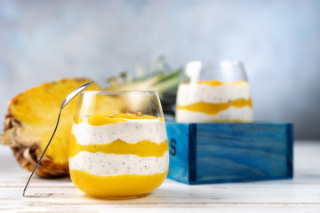 Wall Mural - Mango smoothie with yogurt in two glasses