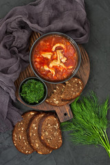 Wall Mural - Red borscht with dill in ceramic  bowl